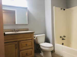 Full bathroom featuring vanity, shower / tub combination, and tile patterned floors