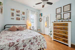 Bedroom featuring light wood-style floors and ceiling fan