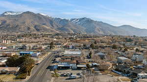 View of mountain backdrop featuring nearby suburban area