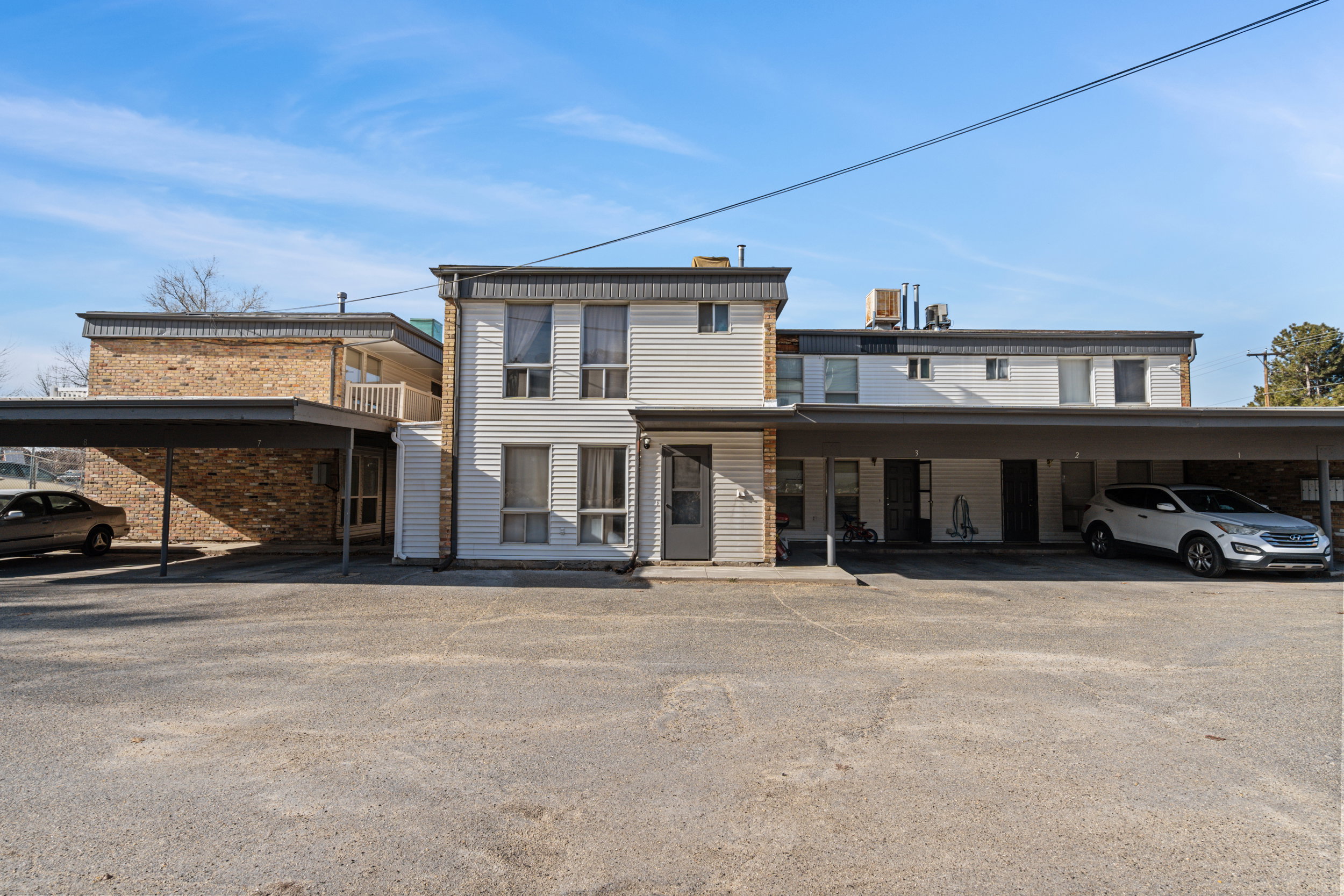 View of front of property featuring covered parking