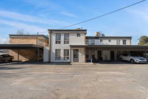 View of front of property featuring covered parking