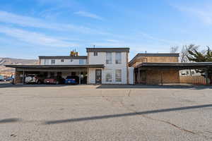 View of front of house featuring covered parking and a mountain view