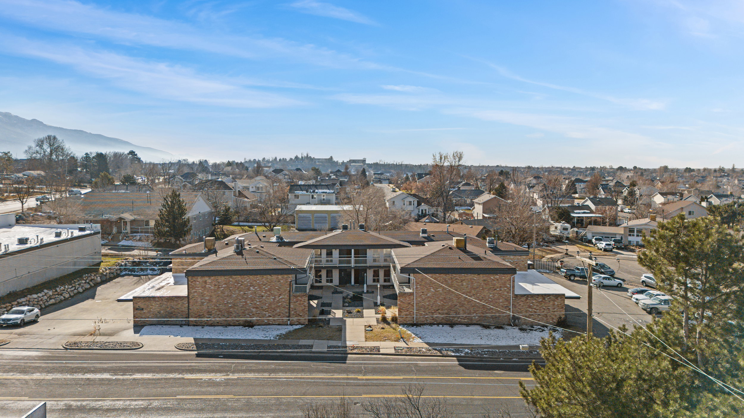 City view with nearby suburban area and mountains