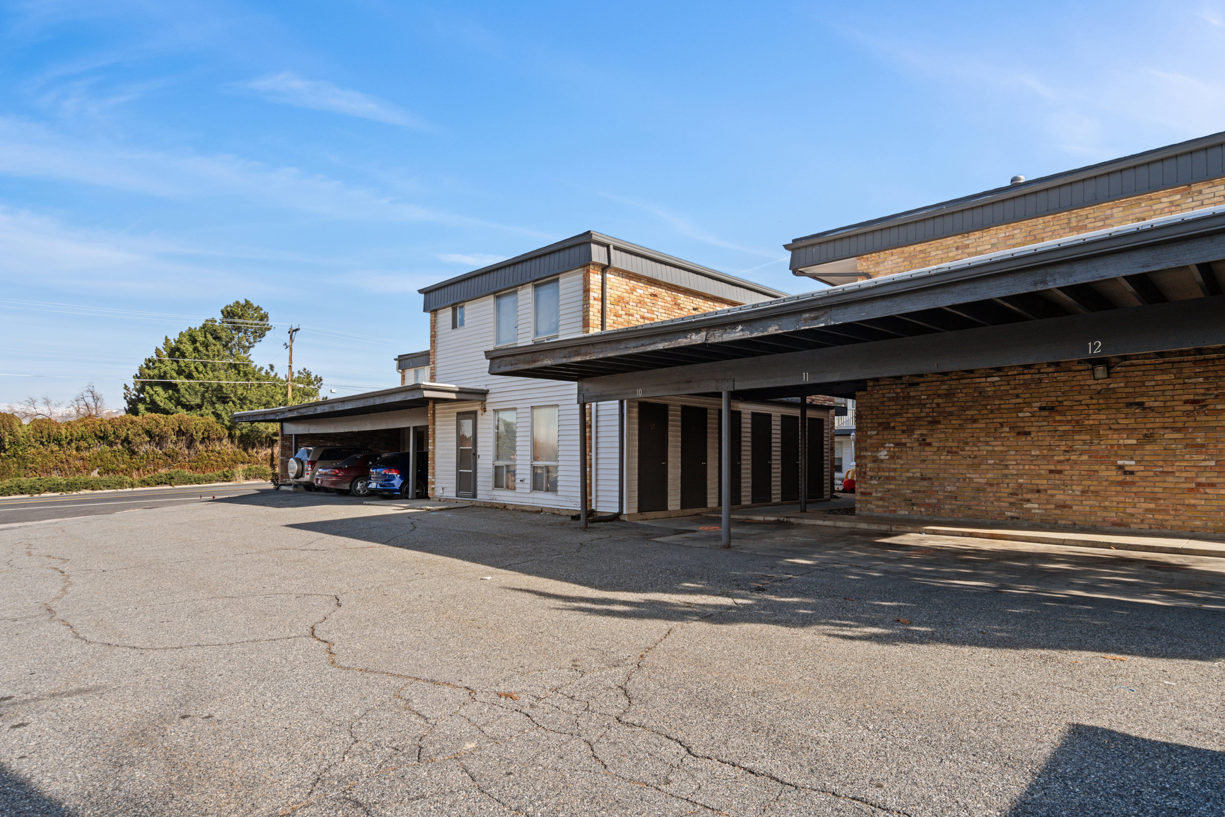 View of property with covered parking