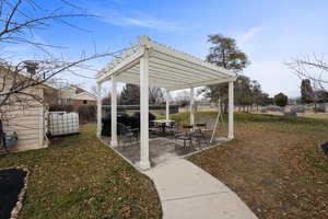 Fenced yard featuring a patio and a pergola