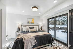 Carpeted bedroom with access to outside and recessed lighting