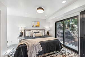 Bedroom featuring access to exterior and recessed lighting