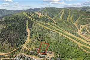 View of rural area featuring property parcel outlined and a mountain backdrop