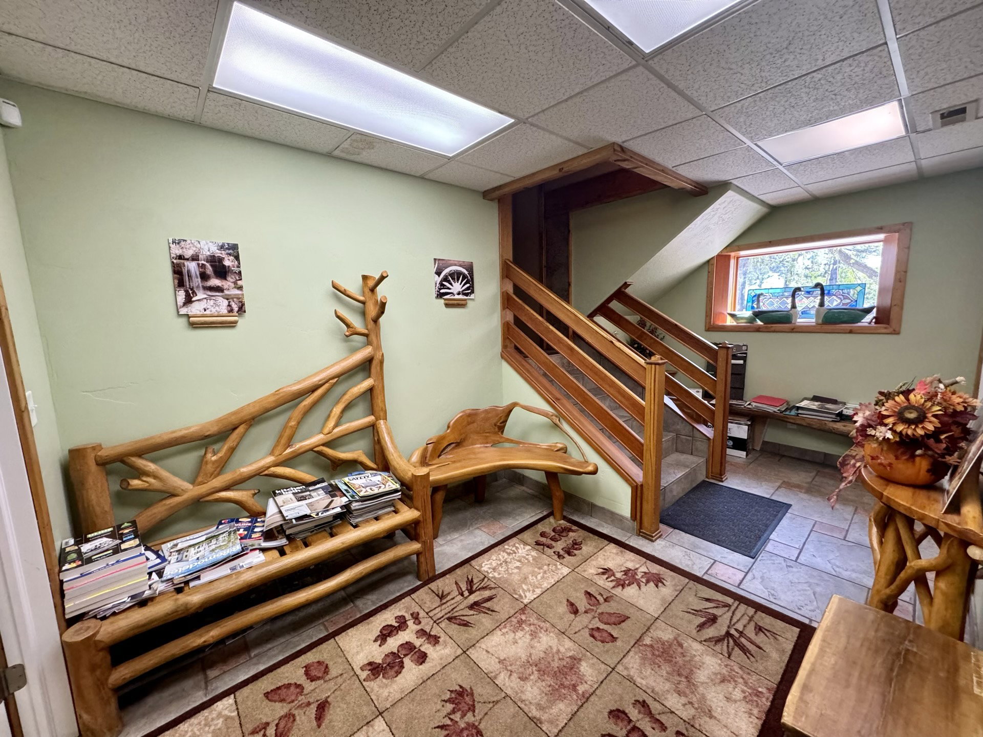 Playroom with a drop ceiling and stone tile flooring