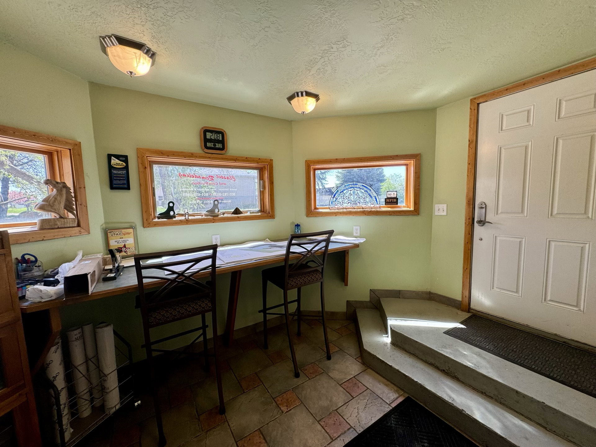 Home office featuring stone tile flooring and a textured ceiling
