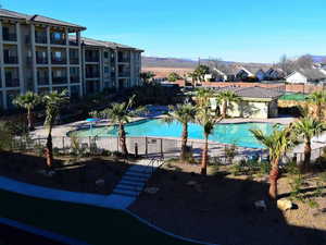 Community pool featuring a patio