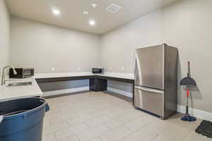 Misc room featuring recessed lighting and light tile patterned floors
