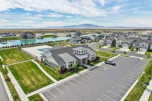 Aerial perspective of suburban area featuring a water and mountain view