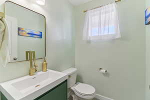 Bathroom featuring vanity and toilet
