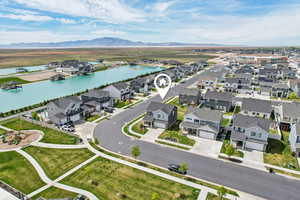 Aerial view of residential area featuring a water and mountain view