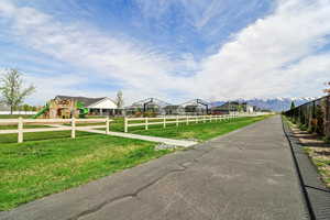 View of asphalt street featuring a mountain view