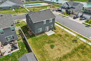 Aerial view of residential area featuring a large body of water