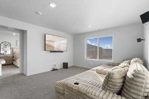 Carpeted bedroom featuring baseboards and recessed lighting
