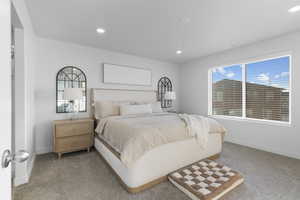 Carpeted bedroom featuring baseboards and recessed lighting