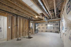 Basement featuring heating unit