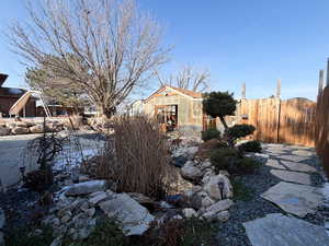 .92 Acre. Detached studio guest house 896 sq ft. $1800/month immediate income to help off set the mortgage 40x60 heated workshop with a 18' door. Outdoor pool. View of property location featuring property boundaries highlighted and a pool