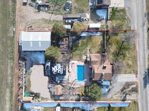 .92 Acre. Detached studio guest house 896 sq ft. $1800/month immediate income to help off set the mortgage 40x60 heated workshop with a 18' door. Outdoor pool. View of property location featuring property boundaries highlighted and a pool