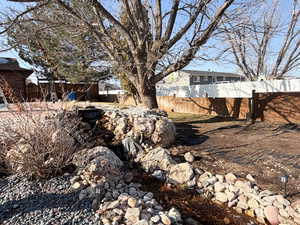 .92 Acre. Detached studio guest house 896 sq ft. $1800/month immediate income to help off set the mortgage 40x60 heated workshop with a 18' door. Outdoor pool. View of property location featuring property boundaries highlighted and a pool