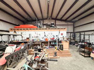 .92 Acre. Detached studio guest house 896 sq ft. $1800/month immediate income to help off set the mortgage 40x60 heated workshop with a 18' door. Outdoor pool. View of property location featuring property boundaries highlighted and a pool