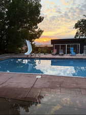 .92 Acre. Detached studio guest house 896 sq ft. $1800/month immediate income to help off set the mortgage 40x60 heated workshop with a 18' door. Outdoor pool. View of property location featuring property boundaries highlighted and a pool