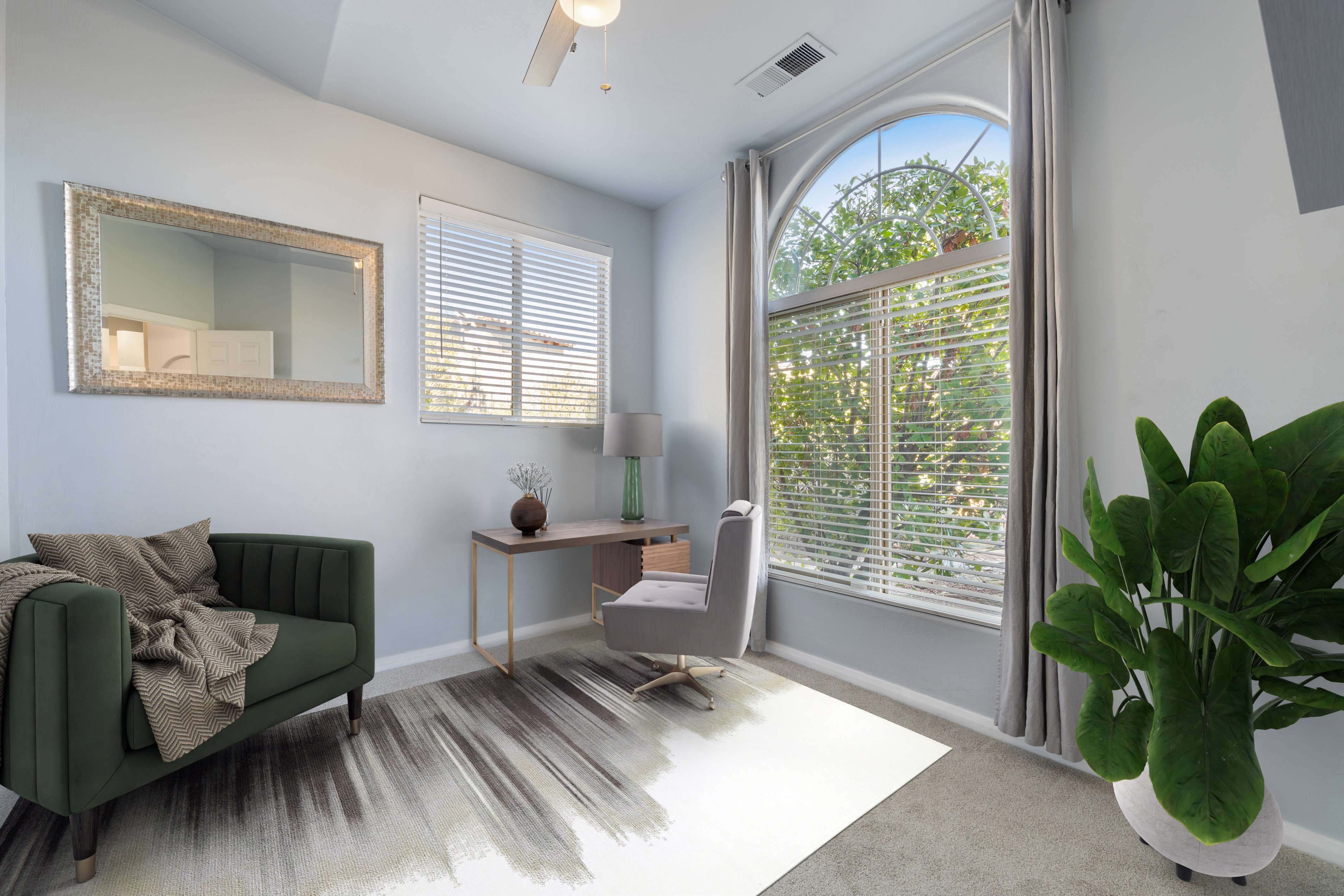 Sitting room with carpet floors, an office area, and a ceiling fan