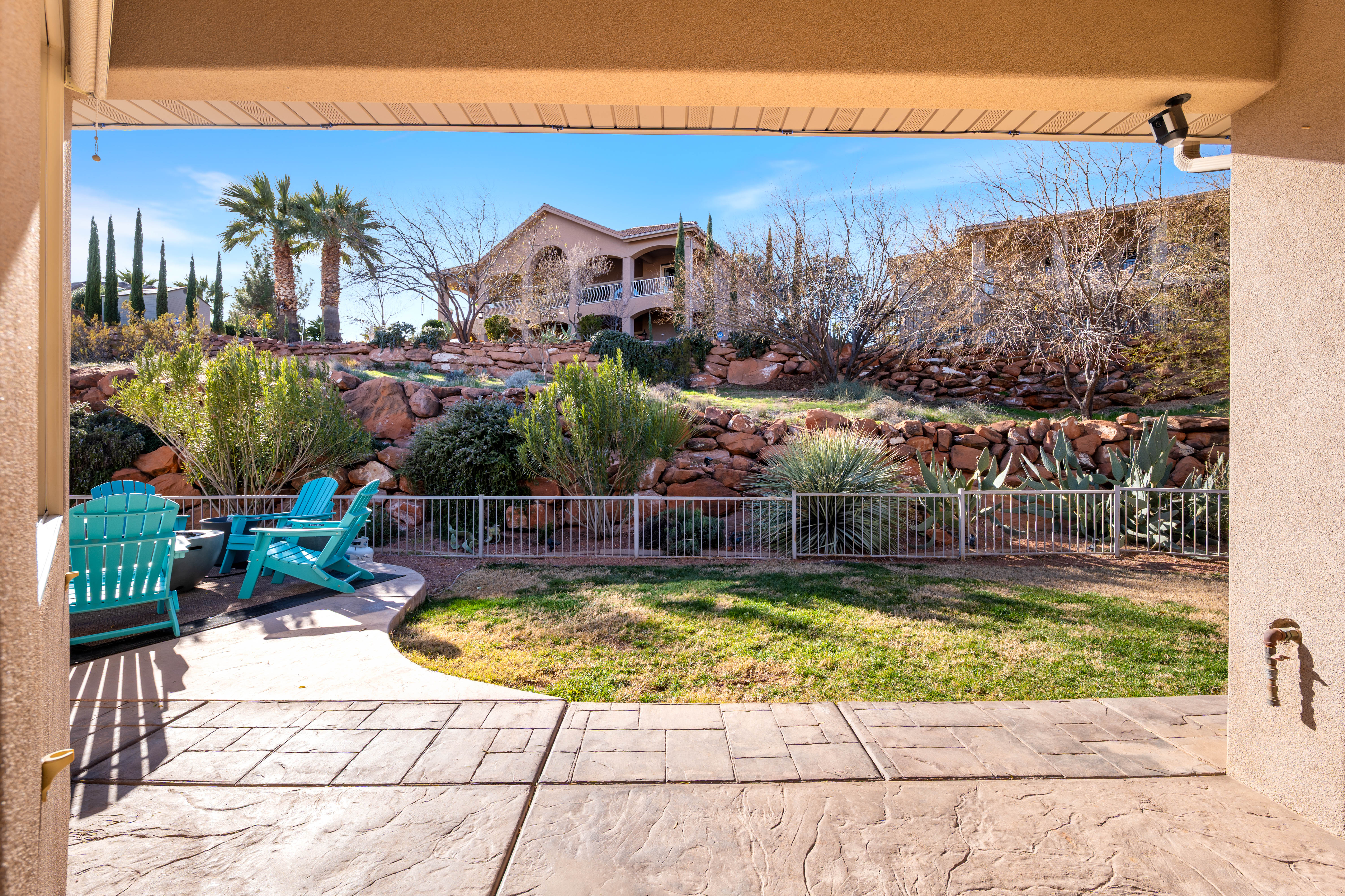 Fenced backyard featuring a patio