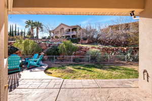 Fenced backyard featuring a patio
