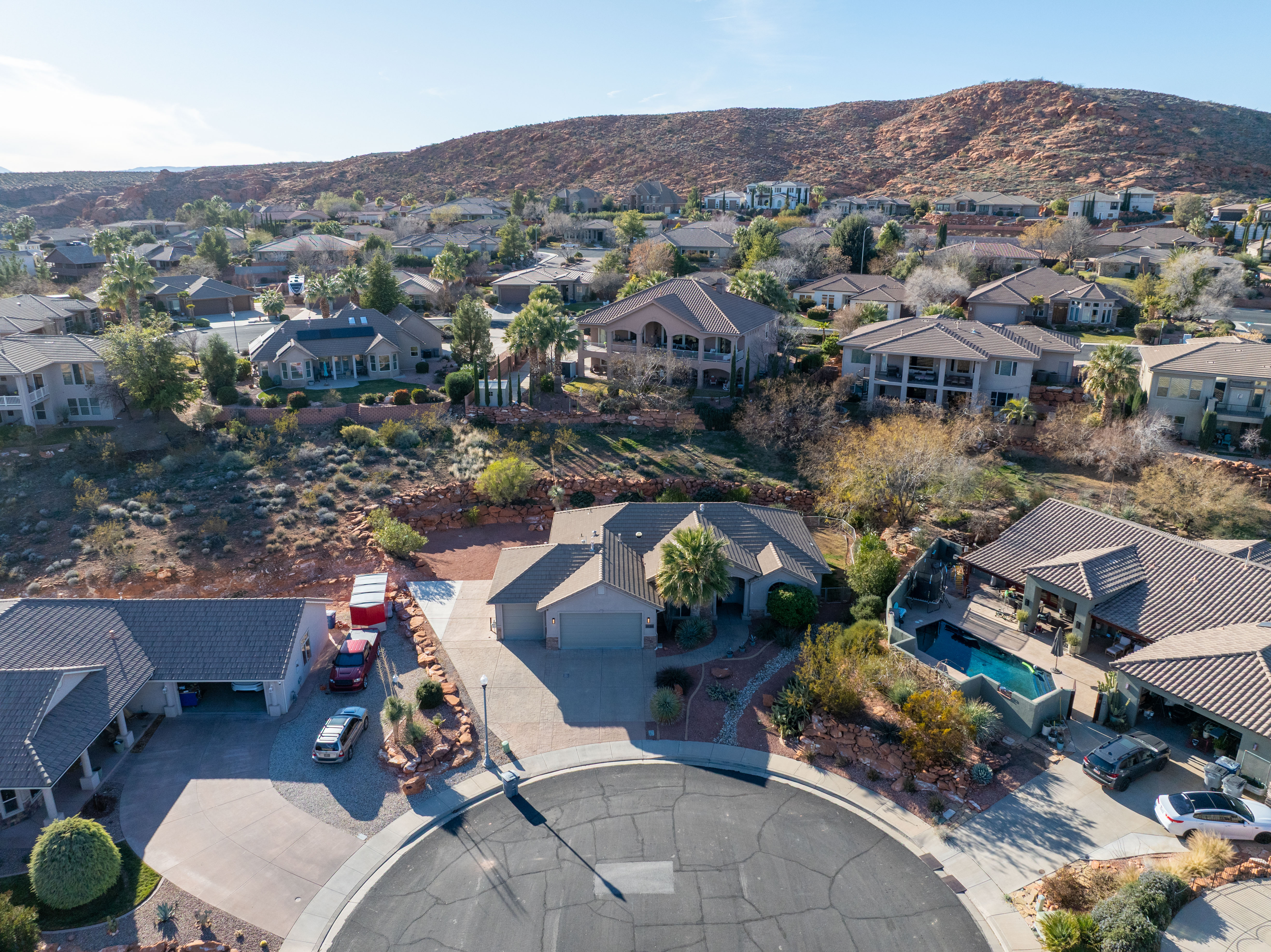 Aerial perspective of suburban area featuring a mountain backdrop