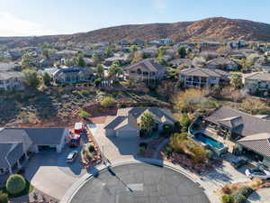 Aerial perspective of suburban area featuring a mountain backdrop