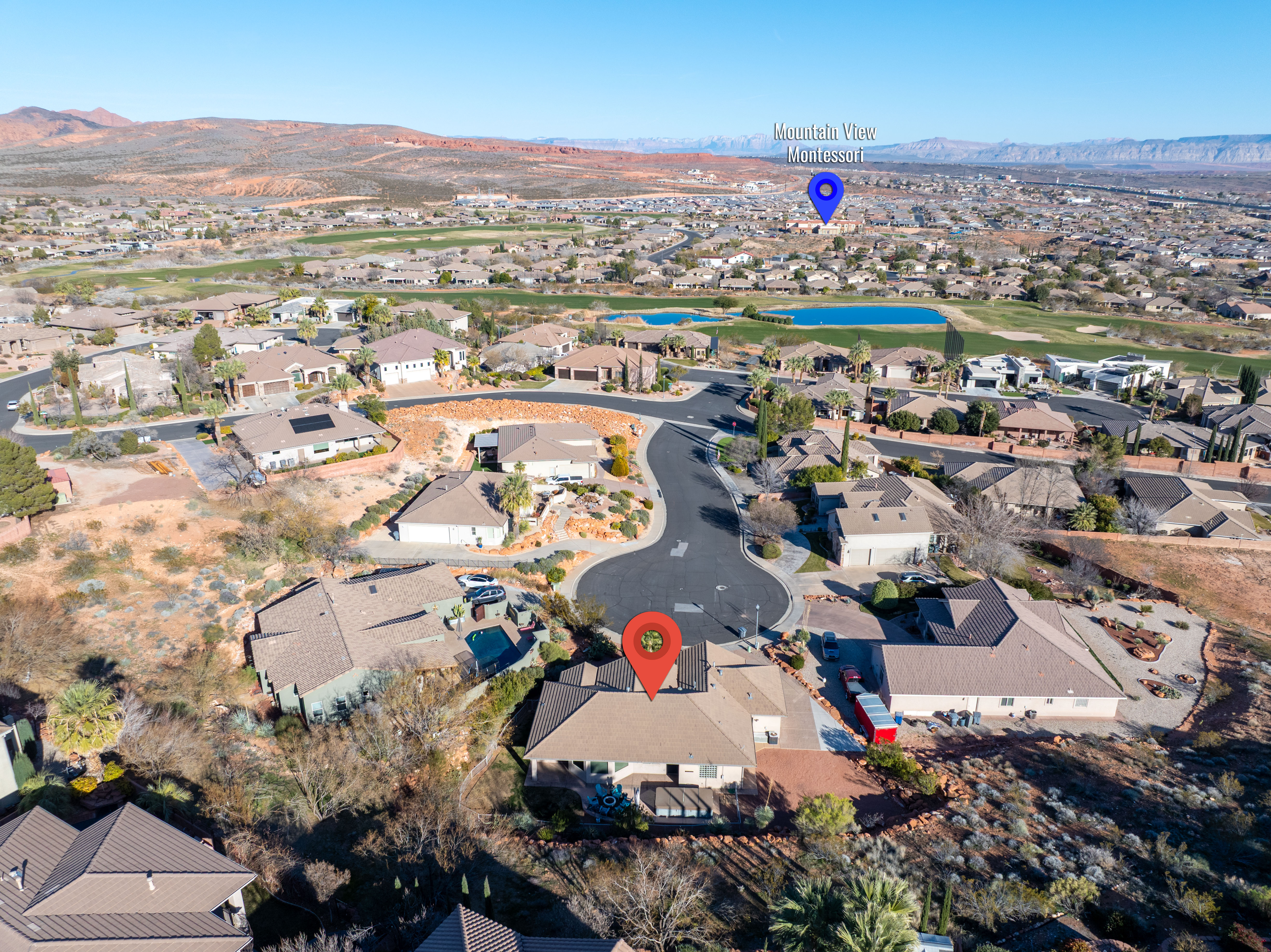 Aerial overview of property's location featuring a water and mountain view and nearby suburban area