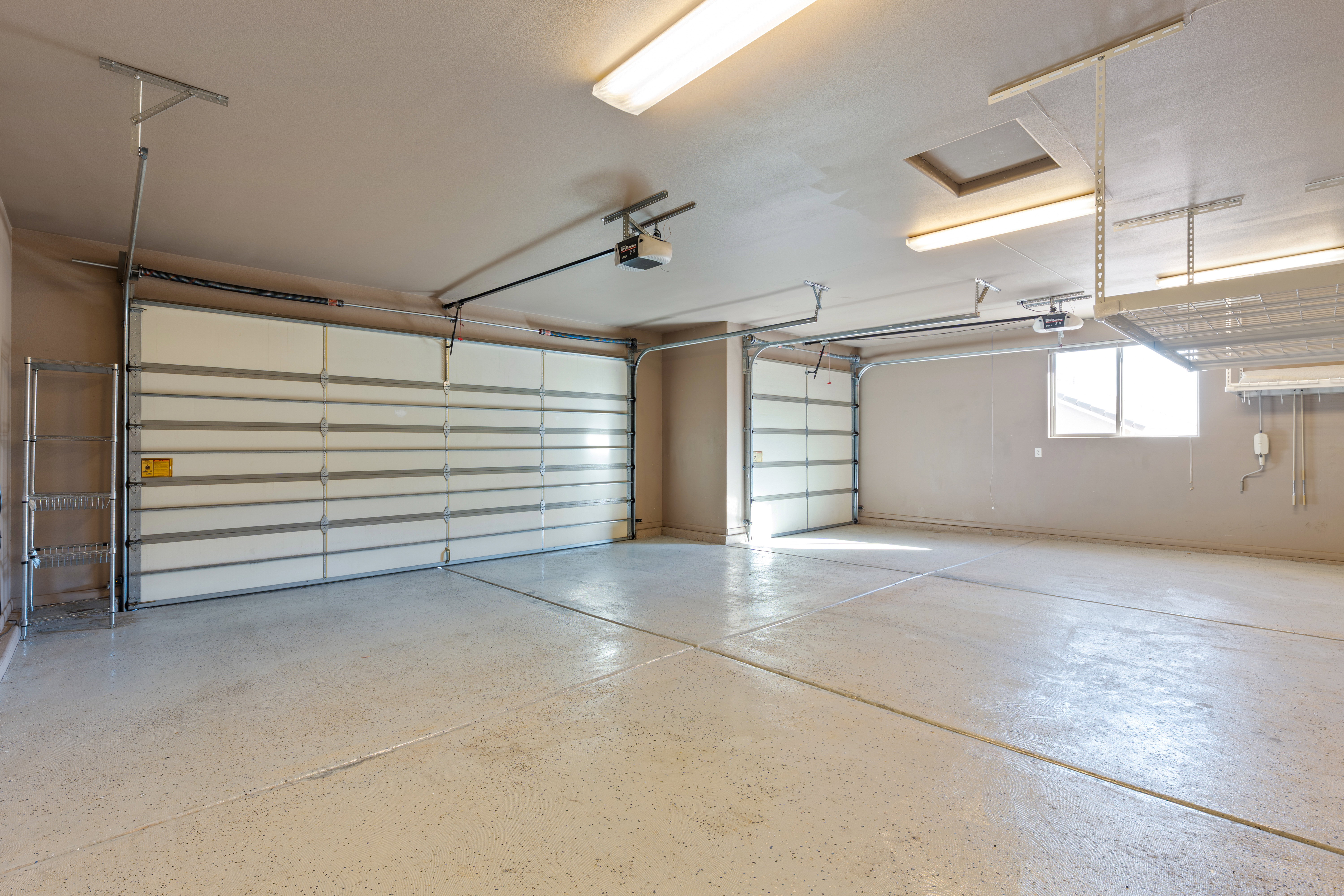 Garage featuring a garage door opener