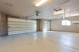 Garage featuring a garage door opener
