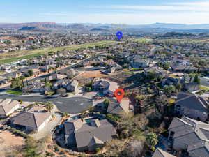 Aerial view of residential area featuring a mountain backdrop