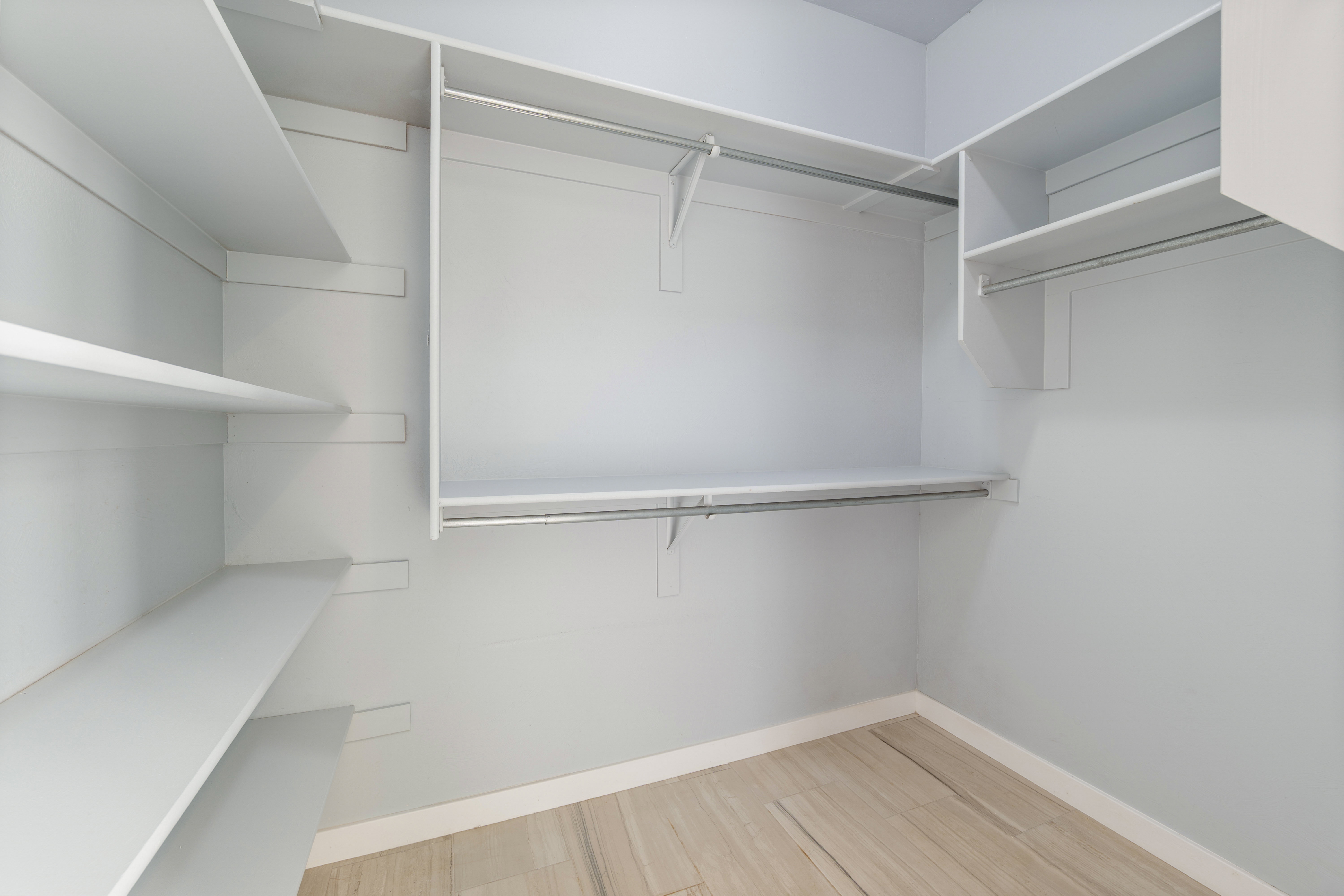 Walk in closet featuring light wood-style flooring