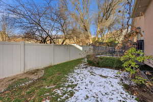 View of fenced backyard