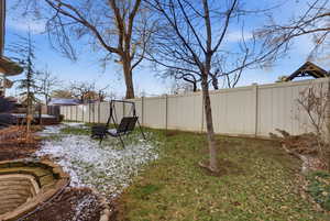 View of fenced backyard
