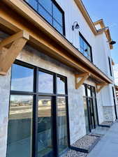 Entrance to property with stone siding