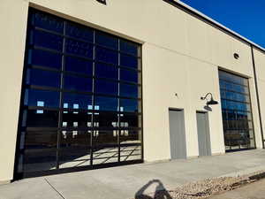 View of building exterior featuring a garage