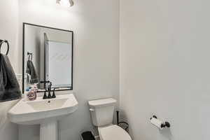 Half bath on main, next to built in mudroom.