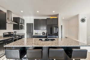 Kitchen with mudroom, half bath, and garage entrance directly to the right.