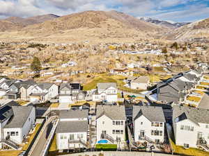 Aerial perspective of suburban area featuring a mountain backdrop. No backyard neighbors!