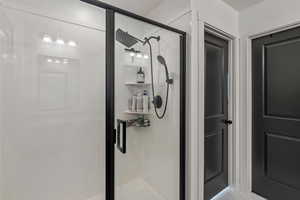 Full bath with full glass and corner caddy