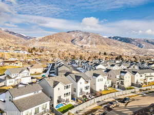 Aerial view of residential area with mountains. No backyard neighbors!