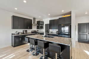 Kitchen with mudroom, half bath, and garage entrance directly to the right.