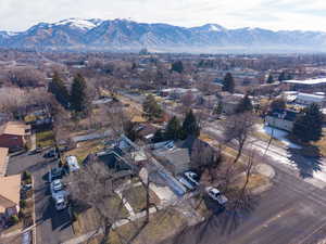 Aerial view of residential area featuring a mountainous background
